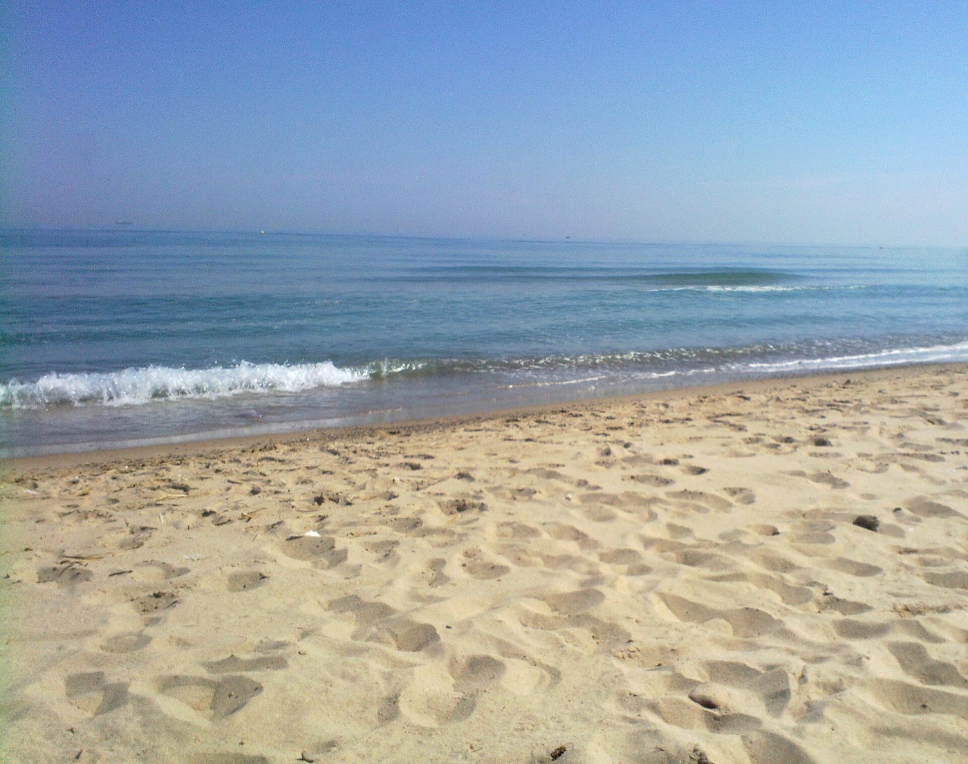 Natural sandy beach and Mediterranean water at Playa de la Devesa near Valencia