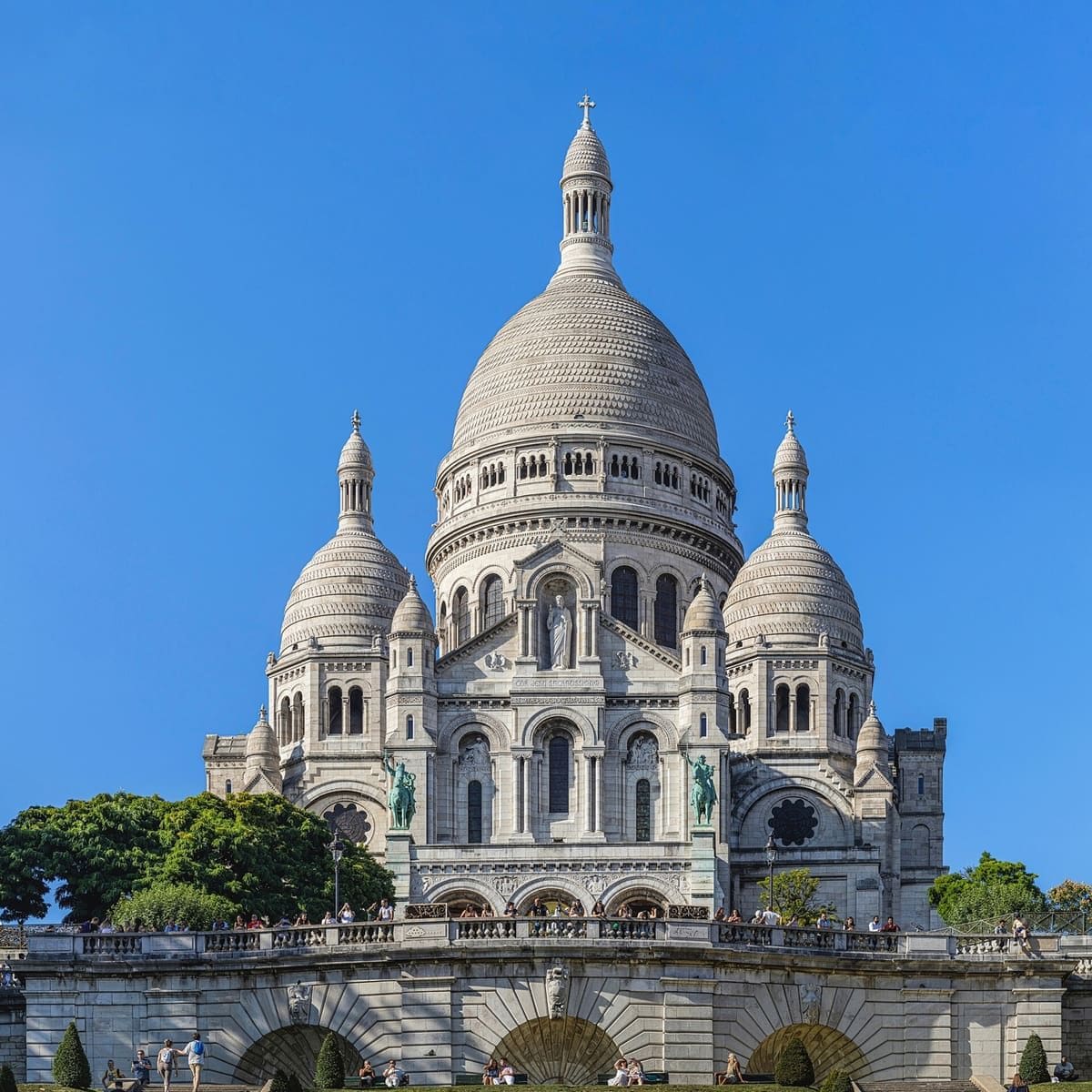 White domes of Sacré-Cœur Basilica above the steps of Montmartre in Paris