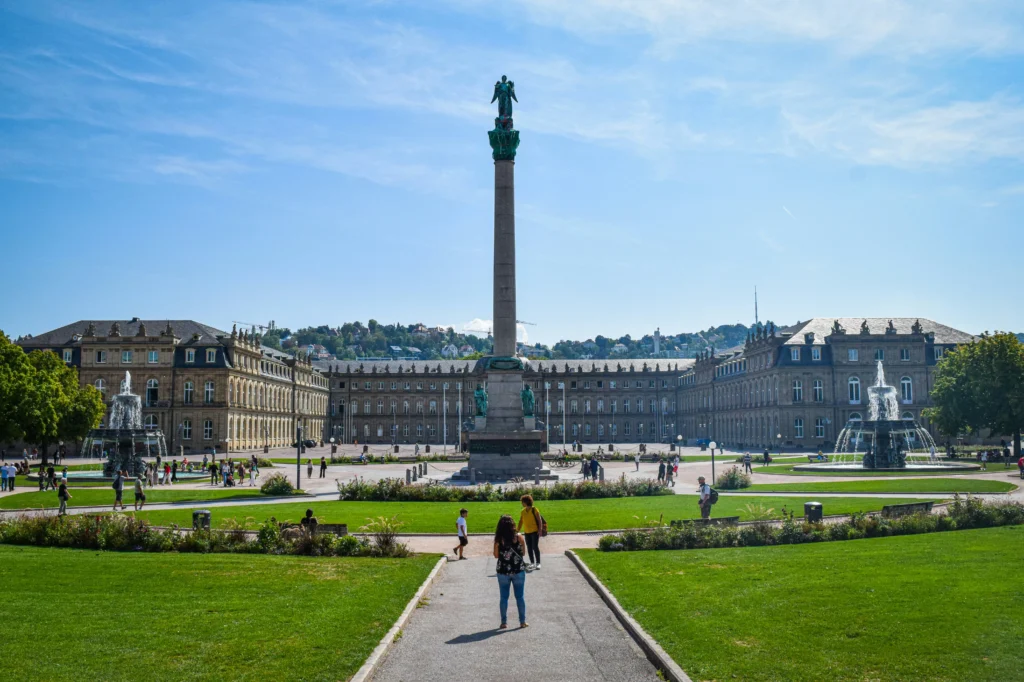 Schlossplatz Stuttgart with New Palace and fountains in summer